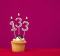 Candle number 133 - cupcake birthday in rhodamine red background