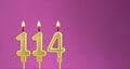 Candle number 114 in purple background - birthday card Royalty Free Stock Photo