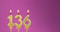 Birthday card with candle number 136 - purple background