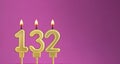 Birthday card with candle number 132 - purple background Royalty Free Stock Photo