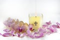 Candle, Orchids, and Rose Petals Royalty Free Stock Photo