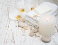 Candle, orchids and towels Royalty Free Stock Photo