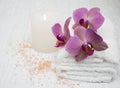 Candle, orchids and towels Royalty Free Stock Photo