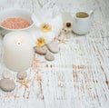 Candle, orchids and towels Royalty Free Stock Photo