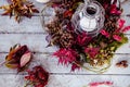 a candle, plates and flowers and candleholders are on the floor Royalty Free Stock Photo