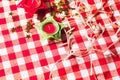Candle on red checkered tablecloths and garland Royalty Free Stock Photo