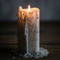 The candle\'s body shows layers of hardened wax, creating a textured appearance Royalty Free Stock Photo