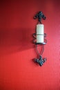 Candle sconce on red wall Royalty Free Stock Photo