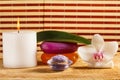 Candle, sea salt, soap and white orchid flower for spa Royalty Free Stock Photo