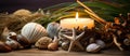 A candle and seashells with starfish on a wooden table Royalty Free Stock Photo