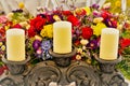 Candle stand and floral arrangement Royalty Free Stock Photo