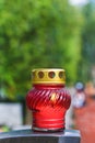 Candle on stone tomb at cemetery