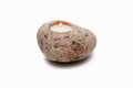 Candle in stone on a white background Royalty Free Stock Photo