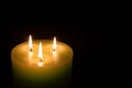 Candle with three flames on black background Royalty Free Stock Photo