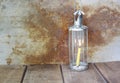 Candle in vintage lamplight on wooden table