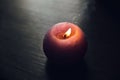 Candle on wooden background