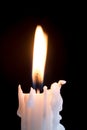 Candleflame on a lit white candle Royalty Free Stock Photo