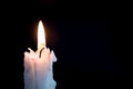 Candleflame on a lit white candle. Royalty Free Stock Photo