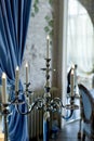 Candleholder on a long leg of the led candles.Wedding decoration of the hall.