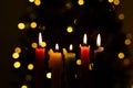 Candlelight Day. Traditional Colombian holiday. Group of candles lit at night with unfocused lights in the background Royalty Free Stock Photo