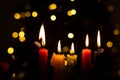 Candlelight Day. Traditional Colombian holiday. Group of candles lit at night with unfocused lights in the background Royalty Free Stock Photo