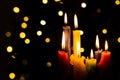 Candlelight Day. Traditional Colombian holiday. Group of candles lit at night with unfocused lights in the background Royalty Free Stock Photo