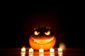 Candlelight halloween pumpkin smile with burning fire eyes mouth