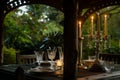 candlelit table with crystal glassware in a garden gazebo