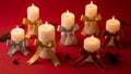 Candles with Bows on Red Background Royalty Free Stock Photo