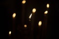 Candles burn in dark. Candle lights. Flames on black background Royalty Free Stock Photo