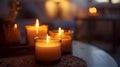 Short candles are burning against a dark background. Royalty Free Stock Photo