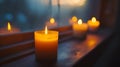 Short candles are burning against a dark background. Royalty Free Stock Photo