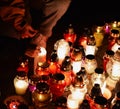 Candles burning at a cemetery during All Saints Day. Royalty Free Stock Photo