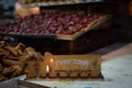 A single flame remains on a Hanukkah menorah.