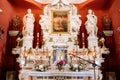 Candles in candlesticks in front of the altar of the Church of Our Lady of the Rocks. Perast Royalty Free Stock Photo