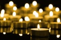 Candles on christmas night signifying hope. Gold. Background. Selective focus