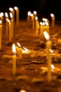 Candles in a church in memory of the dead and saints. Royalty Free Stock Photo