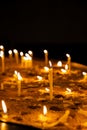 Candles in a church in memory of the dead and saints. Royalty Free Stock Photo
