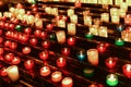 Candles in the dark in several rows. Side view Royalty Free Stock Photo
