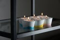 Candles in a differen colours concrete candle holders