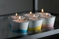 Candles in a differen colours concrete candle holders