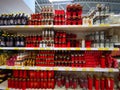 Candles of different sizes on shelves at Jumbo store