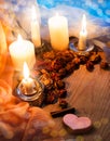 Candles and dried rosebuds on the table