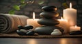 candles, flower, towel and stones for thalassotherapy in the spa area.