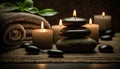 candles, flower, towel and stones for thalassotherapy in the spa area.