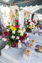 Candles and Flowers over Grave in The Annual Blessing of Graves at Ratchaburi Province, Thailand Royalty Free Stock Photo