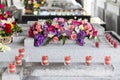 Candles and Flowers over Grave in The Annual Blessing of Graves at Ratchaburi Province, Thailand Royalty Free Stock Photo