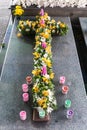 Candles and Flowers over Grave in The Annual Blessing of Graves at Ratchaburi Province, Thailand Royalty Free Stock Photo