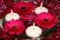 Candles and flowers in water