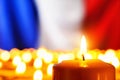 Candles in front of the France flag Royalty Free Stock Photo